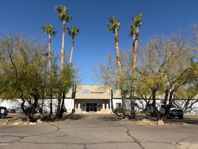 Commercial property with trimmed palm trees out front