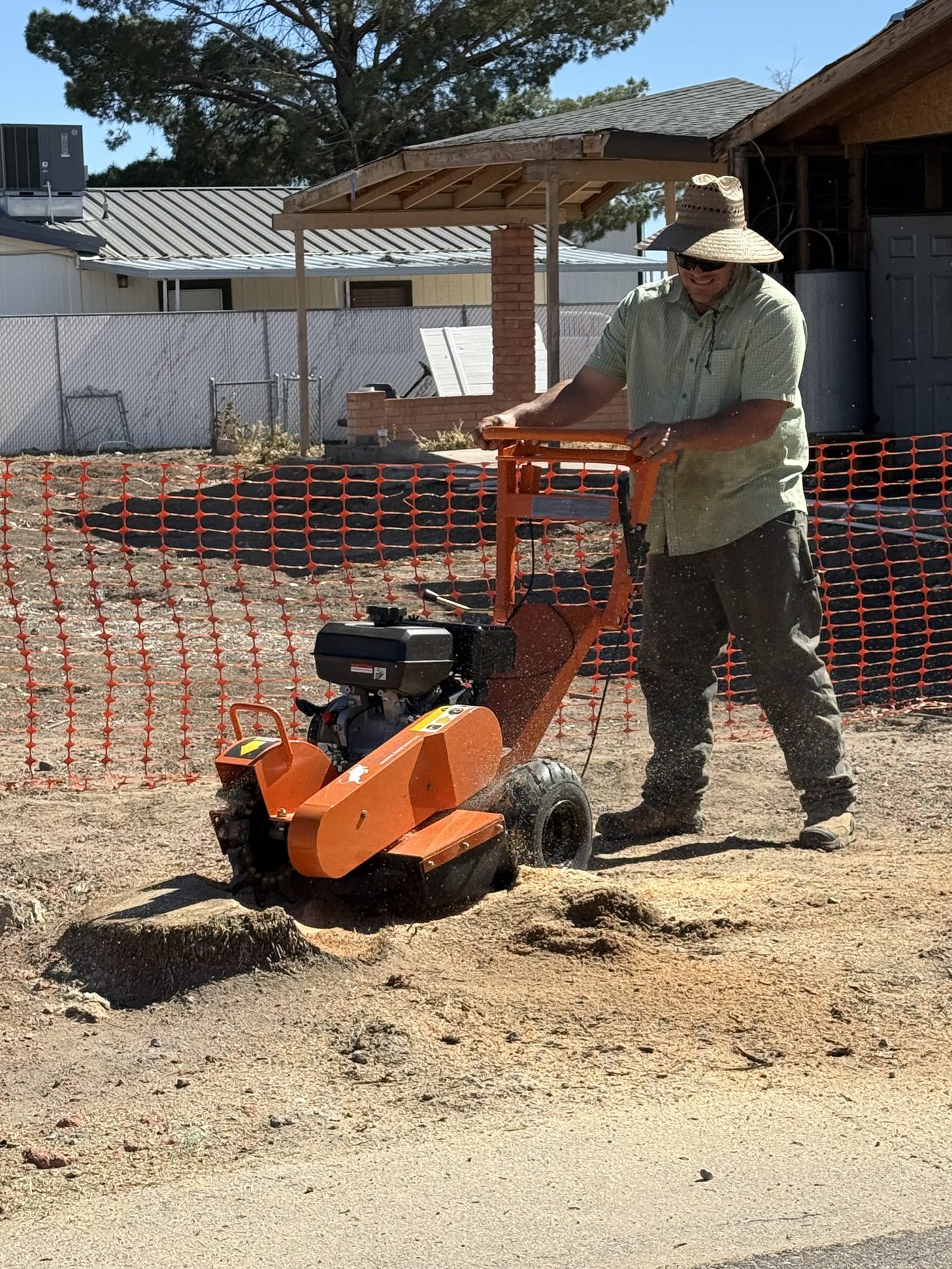 Stump grinding work in a dry Arizona yard