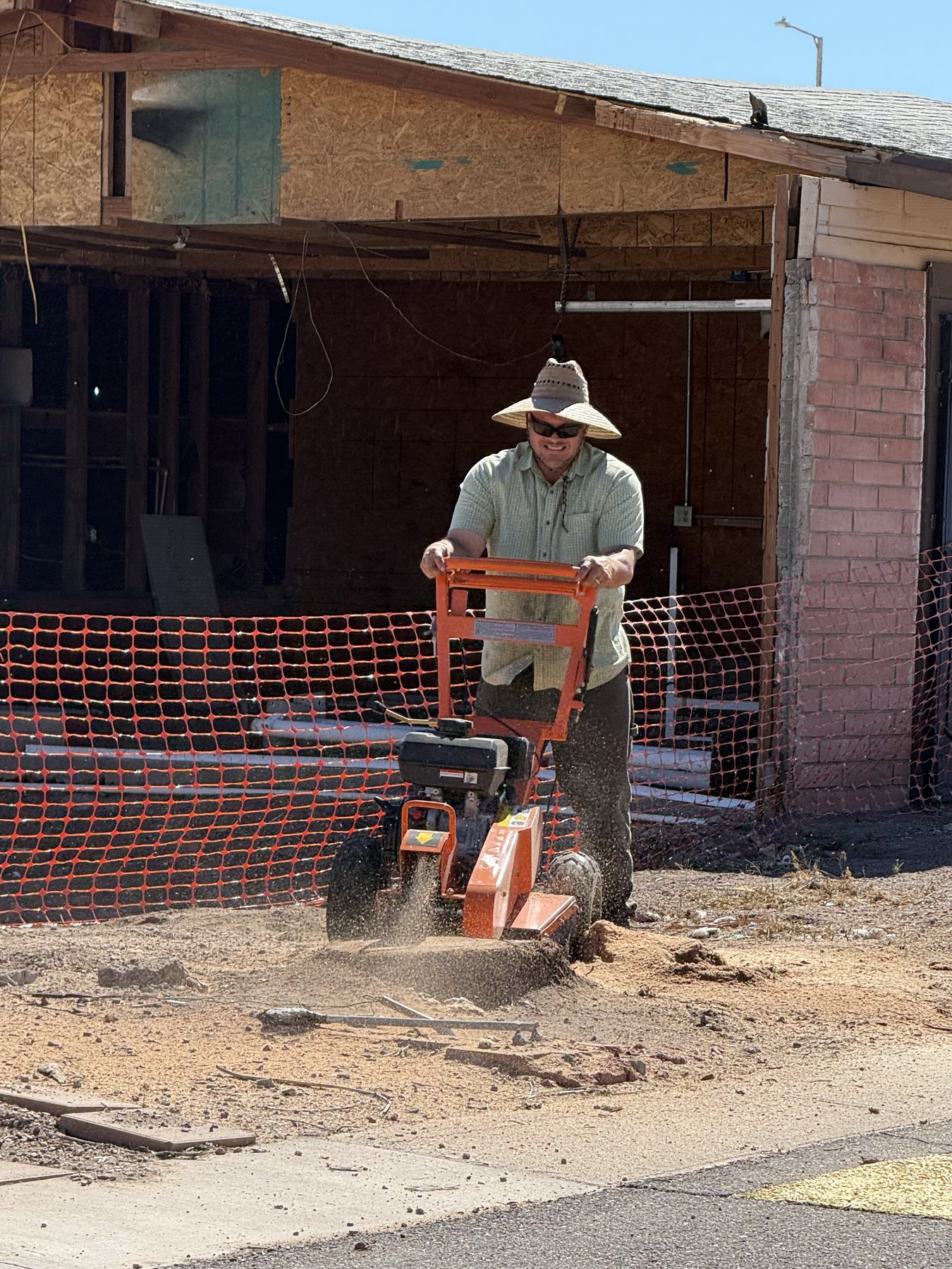 Active stump grinding work at a local property